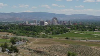 5.7K aerial stock footage of a view of the city skyline from a park and freeway in Reno, Nevada Aerial Stock Footage | DX0001_004_005