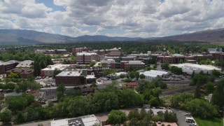 DX0001_004_014 - 5.7K aerial stock footage of passing campus buildings at the University of Nevada in Reno, Nevada