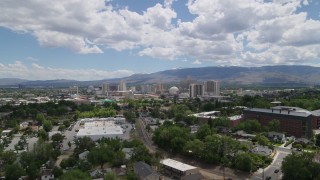 5.7K aerial stock footage of hotels and casinos seen while descending north of the city in Reno, Nevada Aerial Stock Footage | DX0001_004_023