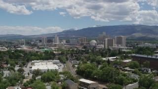 5.7K aerial stock footage of a reverse view of hotels and casinos of the city's skyline in Reno, Nevada Aerial Stock Footage | DX0001_004_028