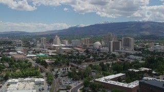 5.7K aerial stock footage of a view of hotels and casinos of the city's skyline while descending in Reno, Nevada Aerial Stock Footage | DX0001_004_031