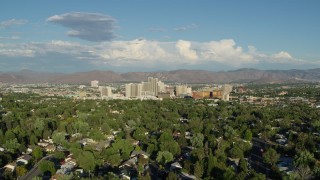 5.7K aerial stock footage of a view of the city skyline from tree-lined neighborhoods in Reno, Nevada Aerial Stock Footage | DX0001_005_008