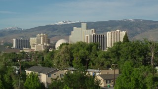 DX0001_006_010 - 5.7K aerial stock footage of the Silver Legacy and Circus Circus resort casinos, seen while descending in Reno, Nevada