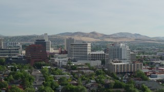 5.7K aerial stock footage of flying by a group of office buildings in Reno, Nevada Aerial Stock Footage | DX0001_006_013