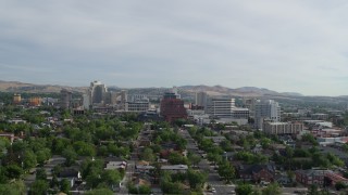 5.7K aerial stock footage reverse view of casino resorts and office buildings seen from neighborhood in Reno, Nevada Aerial Stock Footage | DX0001_006_021