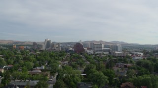 5.7K aerial stock footage descending from a view of casino resorts and office buildings in Reno, Nevada Aerial Stock Footage | DX0001_006_024