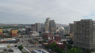 DX0001_006_028 - 5.7K aerial stock footage of a reverse view of the Silver Legacy Resort in Reno, Nevada