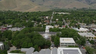 DX0001_007_018 - 5.7K aerial stock footage of reverse view of the Nevada State Capitol, State Library, and reveal Supreme Court in Carson City, Nevada