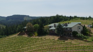 5.7K aerial stock footage of a hilltop home overlooking Phelps Creek Vineyards in Hood River, Oregon Aerial Stock Footage | DX0001_009_018