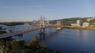 4K aerial stock footage of Tilikum Crossing, Bridge of the People spanning Willamette River, South Portland, Oregon Aerial Stock Footage | DX0001_010_025