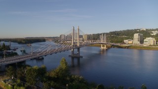 DX0001_010_026 - 4K aerial stock footage ascend to approach the Tilikum Crossing, Bridge of the People, spanning Willamette River, South Portland, Oregon