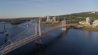 4K aerial stock footage of Tilikum Crossing, Bridge of the People, spanning the Willamette River, South Portland, Oregon Aerial Stock Footage | DX0001_010_027