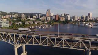 4K aerial stock footage tracking traffic on Marquam Bridge spanning Willamette River, Downtown Portland, Oregon Aerial Stock Footage | DX0001_010_035