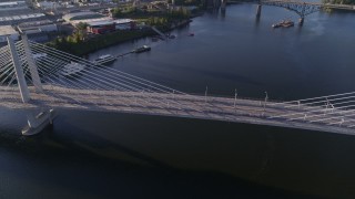 DX0001_010_040 - 4K aerial stock footage orbiting the Tilikum Crossing, pedestrians on bridge, South Portland, Oregon