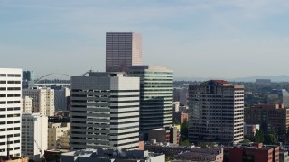 5.7K aerial stock footage of the U.S. Bancorp Tower, descending behind buildings, Downtown Portland, Oregon Aerial Stock Footage | DX0001_011_003