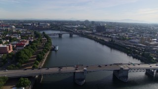 5.7K aerial stock footage stationary shot of Morrison Bridge with light traffic spanning the Willamette, Downtown Portland, Oregon Aerial Stock Footage | DX0001_011_021