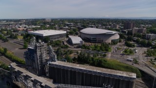 5.7K aerial stock footage flying away from arenas and Steel Bridge, Northeast Portland, Oregon Aerial Stock Footage | DX0001_012_008