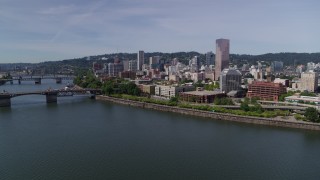 DX0001_012_010 - 5.7K aerial stock footage descending to stationary over Willamette River, looking toward Downtown  Portland, Oregon