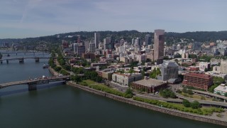 5.7K aerial stock footage reverse and fly over Willamette River from Downtown Portland, Oregon Aerial Stock Footage | DX0001_012_012