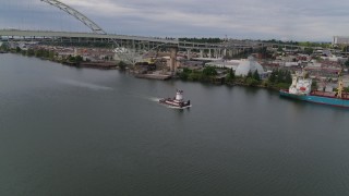 5.7K aerial stock footage of a tugboat in the river, North Portland, Oregon Aerial Stock Footage | DX0001_013_005