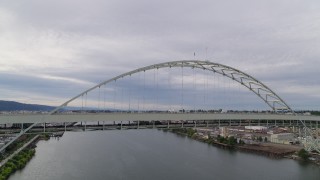 DX0001_013_009 - 5.7K aerial stock footage of Fremont Bridge spanning Willamette River, sunset, Portland, Oregon