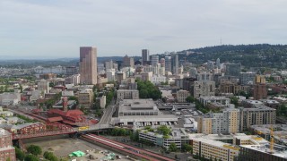 DX0001_013_027 - 5.7K aerial stock footage flying over condominiums toward downtown skyscrapers, sunset, Downtown Portland, Oregon