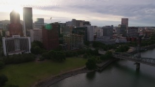 DX0001_014_009 - 5.7K aerial stock footage approaching Downtown Portland, Oregon from the river, sunset