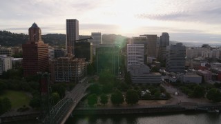 5.7K aerial stock footage of skyscrapers and office buildings near the Willamette River at sunset, Downtown Portland, Oregon Aerial Stock Footage | DX0001_014_010