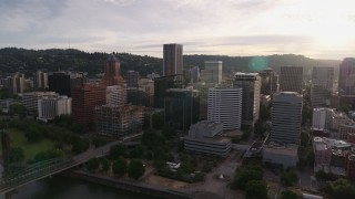 5.7K aerial stock footage of downtown office buildings near the river at sunset, Downtown Portland, Oregon Aerial Stock Footage | DX0001_014_011