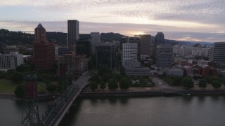 5.7K aerial stock footage side view of Downtown Portland buildings while flying over Hawthorne Bridge, twilight, Oregon Aerial Stock Footage | DX0001_014_019