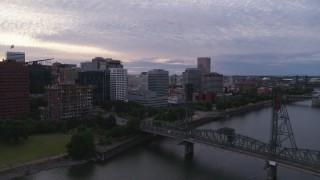 5.7K aerial stock footage of Hawthorne Bridge and office buildings along the water, twilight, Downtown Portland, Oregon Aerial Stock Footage | DX0001_014_025