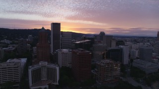 5.7K aerial stock footage of flying away from skyscrapers and waterfront park in Downtown Portland, Oregon, twilight Aerial Stock Footage | DX0001_014_029