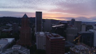 5.7K aerial stock footage flying by office buildings and skyscrapers in Downtown Portland, Oregon at sunset Aerial Stock Footage | DX0001_014_034