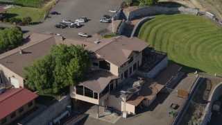 5.7K aerial stock footage of flying by outside tasting area at the Maryhill Winery in Goldendale, Washington Aerial Stock Footage | DX0001_018_025