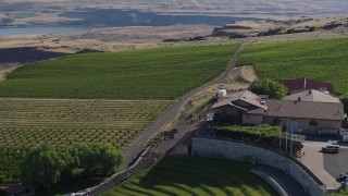 5.7K aerial stock footage of a road and parking lot at the Maryhill Winery in Goldendale, Washington Aerial Stock Footage | DX0001_018_028