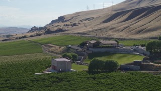 5.7K aerial stock footage of flying around the Maryhill Winery and amphitheater, reveal Columbia River in Goldendale, Washington Aerial Stock Footage | DX0001_018_042