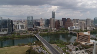 5.7K aerial stock footage of First Street Bridge spanning Lady Bird Lake with view of skyline, Downtown Austin, Texas Aerial Stock Footage | DX0002_102_006