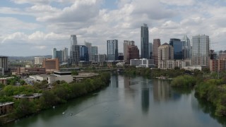 5.7K aerial stock footage of a reverse view of the city skyline from Lady Bird Lake, Downtown Austin, Texas Aerial Stock Footage | DX0002_102_017