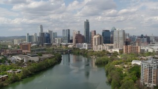 5.7K aerial stock footage fly toward the city skyline from Lady Bird Lake, Downtown Austin, Texas Aerial Stock Footage | DX0002_102_021