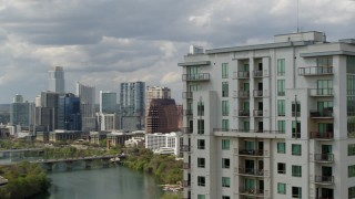 5.7K aerial stock footage a view of skyscrapers in Downtown Austin, Texas while passing a high-rise building Aerial Stock Footage | DX0002_103_006