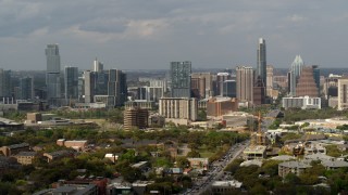 5.7K aerial stock footage of traffic on Congress Avenue leading to the city's skyline, Downtown Austin, Texas Aerial Stock Footage | DX0002_103_031