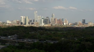 5.7K aerial stock footage ascend from hills for wide view of city skyline, Downtown Austin, Texas Aerial Stock Footage | DX0002_104_017