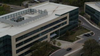 5.7K aerial stock footage of slow orbit around a modern office building in Austin, Texas Aerial Stock Footage | DX0002_104_030