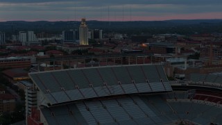 DX0002_105_035 - 5.7K aerial stock footage of UT Tower at the University of Texas at twilight, Austin, Texas