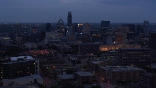 5.7K aerial stock footage fly away from office buildings, capitol and skyscrapers at twilight in Downtown Austin, Texas Aerial Stock Footage | DX0002_105_044