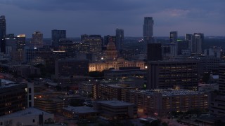 5.7K aerial stock footage flyby office buildings, capitol and skyscrapers at twilight in Downtown Austin, Texas Aerial Stock Footage | DX0002_105_049