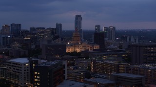 5.7K aerial stock footage ascend near office buildings, capitol and skyscrapers at twilight in Downtown Austin, Texas Aerial Stock Footage | DX0002_105_050