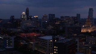 5.7K aerial stock footage descend with view of office buildings, skyscrapers near capitol at twilight in Downtown Austin, Texas Aerial Stock Footage | DX0002_105_054