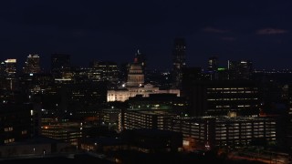 5.7K aerial stock footage of flying by the Texas State Capitol at night in Downtown Austin, Texas Aerial Stock Footage | DX0002_106_009