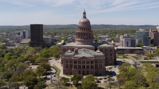 5.7K aerial stock footage ascend over library for view of Texas State Capitol in Downtown Austin, Texas Aerial Stock Footage | DX0002_107_013